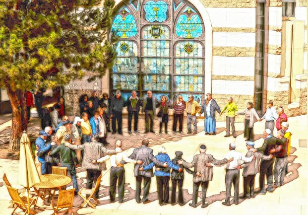 Members of the CBI lay-led minyan stand in the courtyard in a circle with arms around each other.