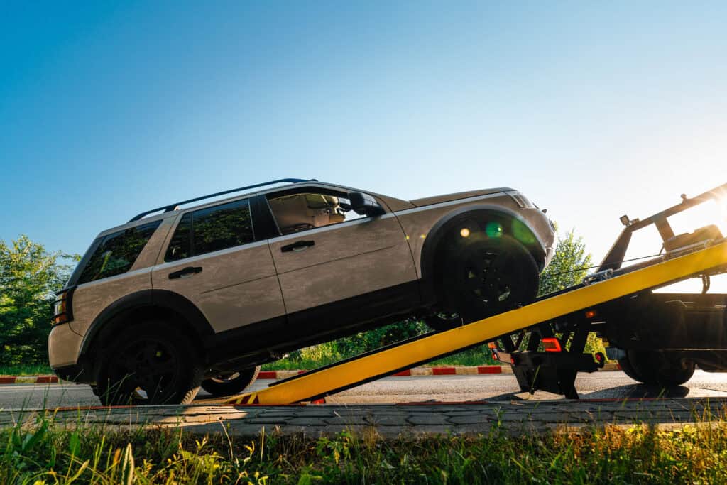 SUV being loaded onto a tow tuck