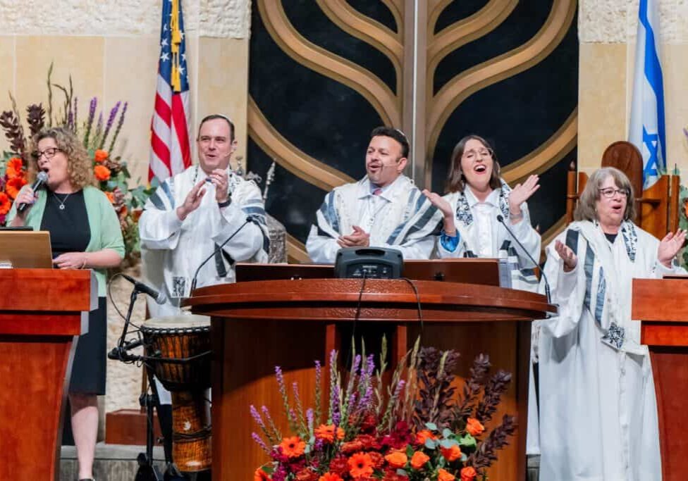 Clergy members sing and pray during a celebratory Rosh Hashanah service.