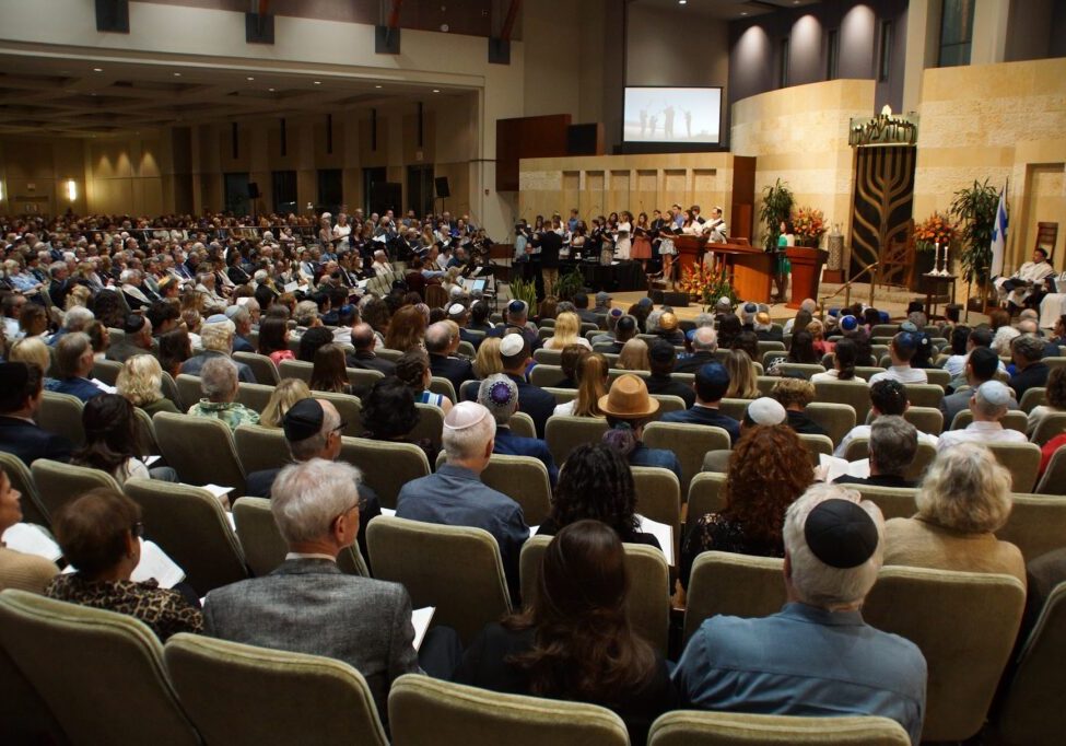 The inside of the Beth Israel sanctuary, full of people during services.